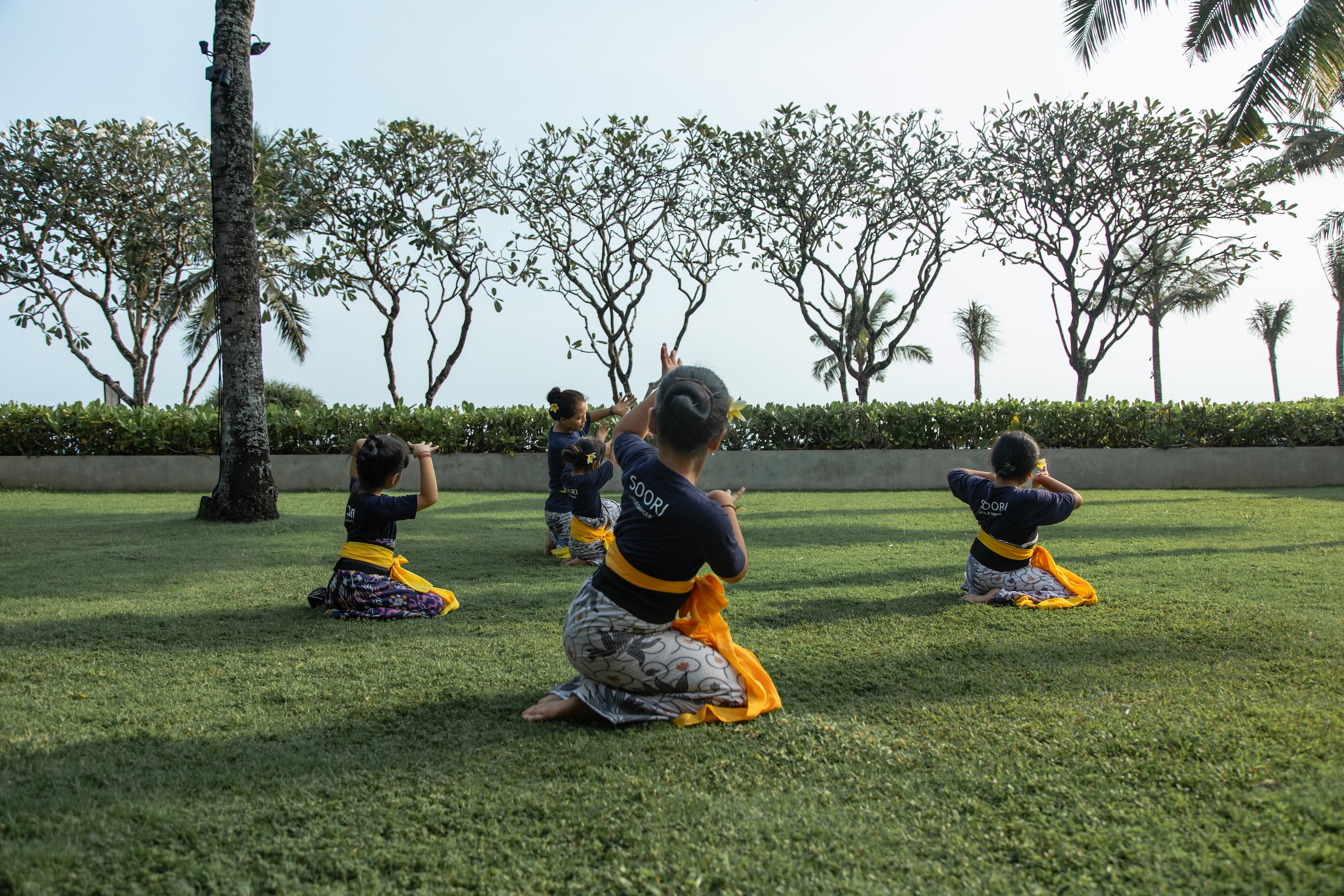 Young Balinese dancers practising outdoors at Soori Bali